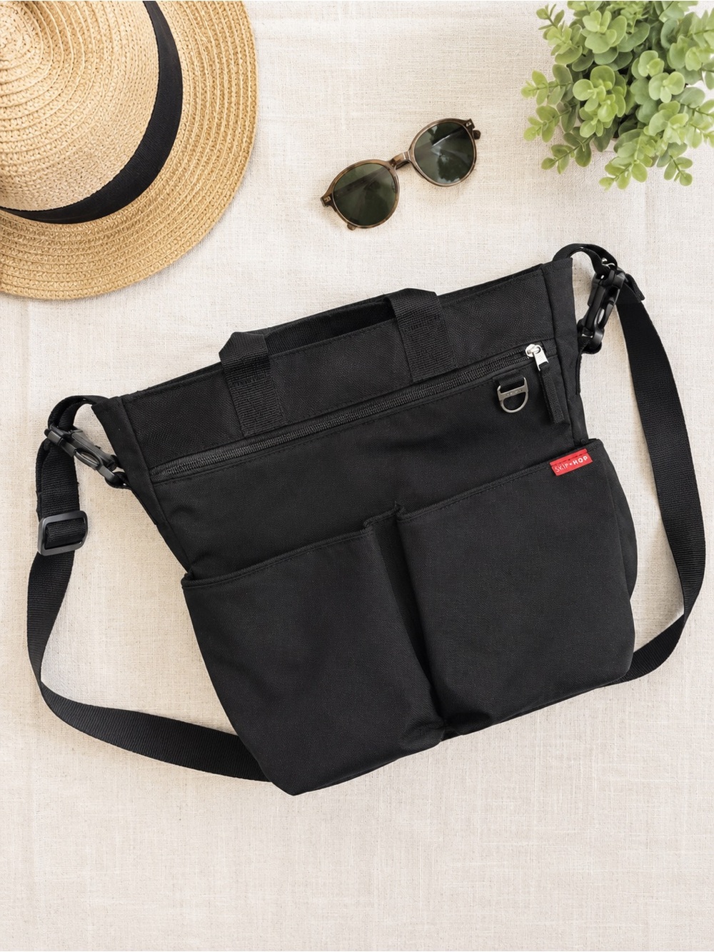 Black Skip Hop Canvas Diaper Bag and matching diaper changing pad clutch